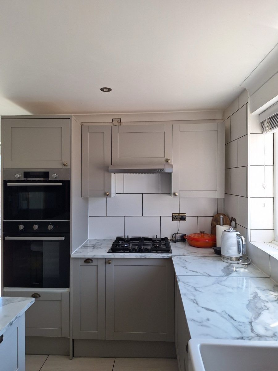 Grey shaker kitchen with marble worktop