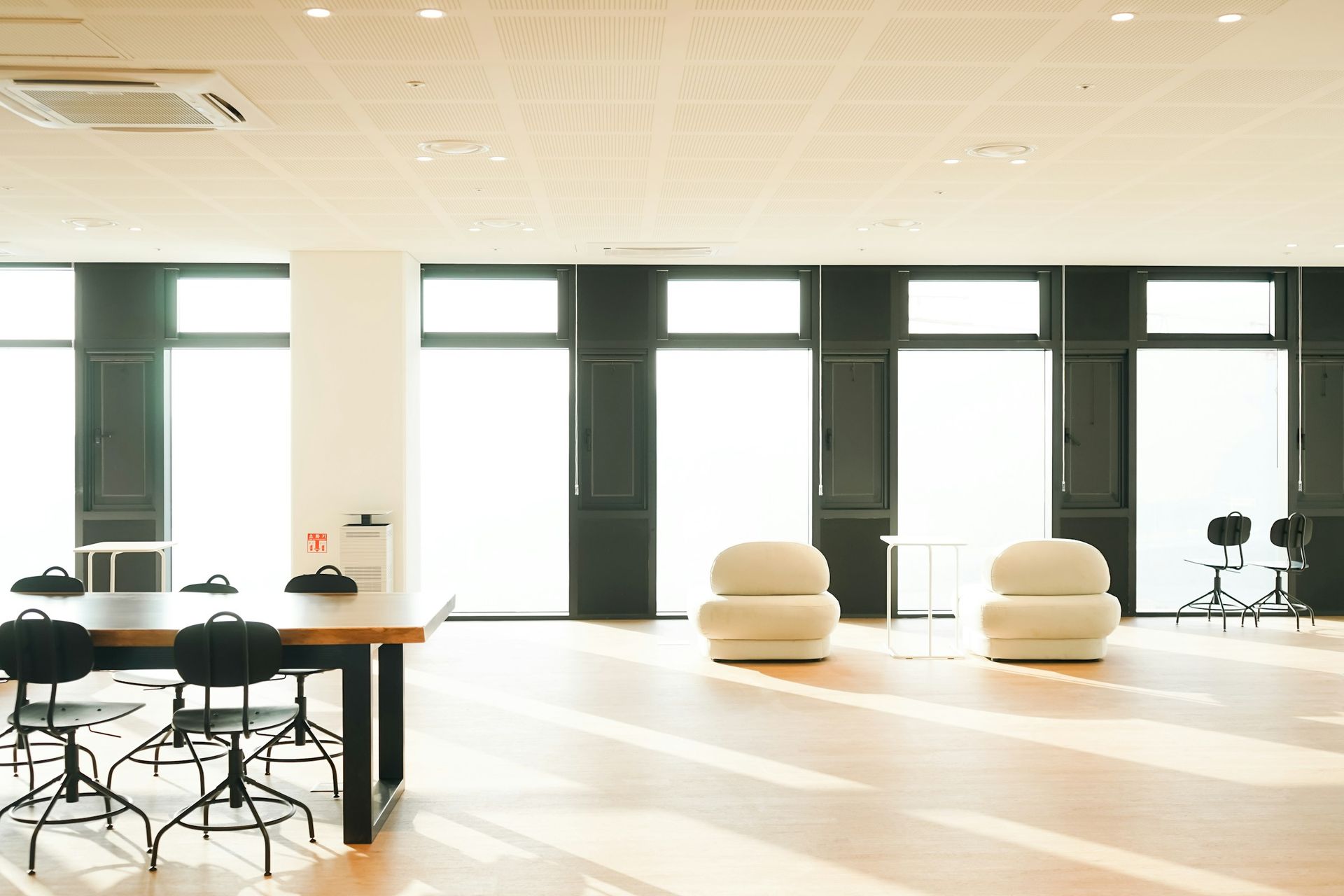 Bright modern commercial space with tables and chairs
